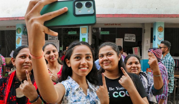 First time voters take selfie after casting votes